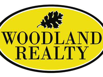 Woodland Realty logo